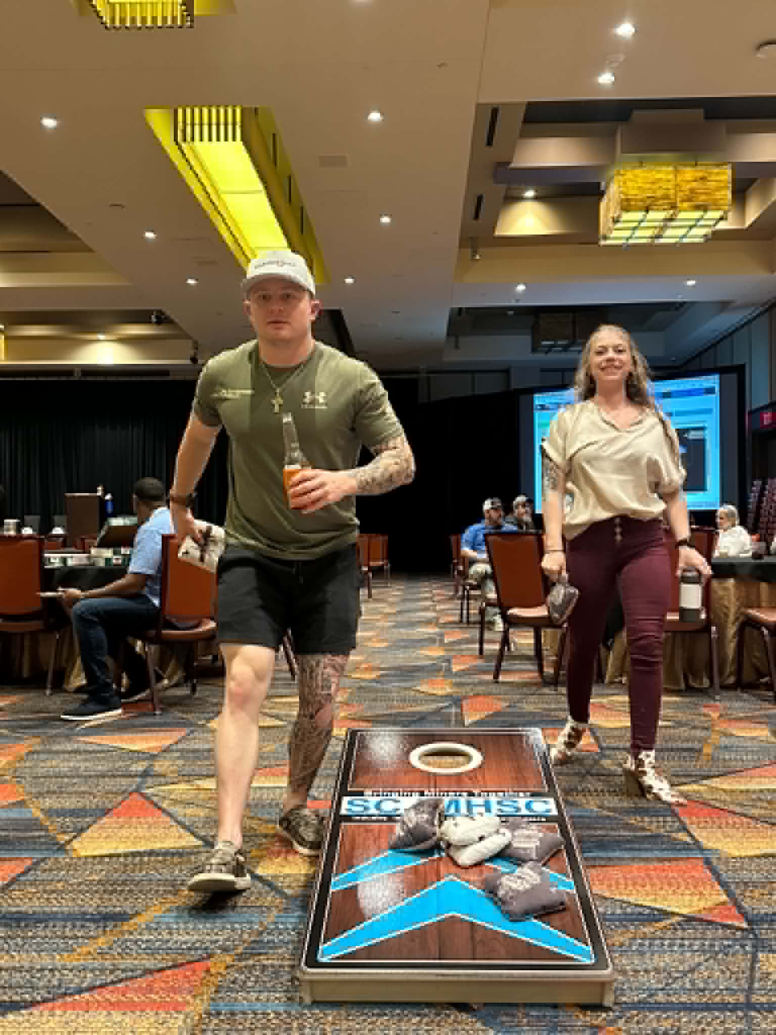 Attendees playing cornhole at the 2026 South Central Joint Mine Health and Safety Conference in Durant, Oklahoma